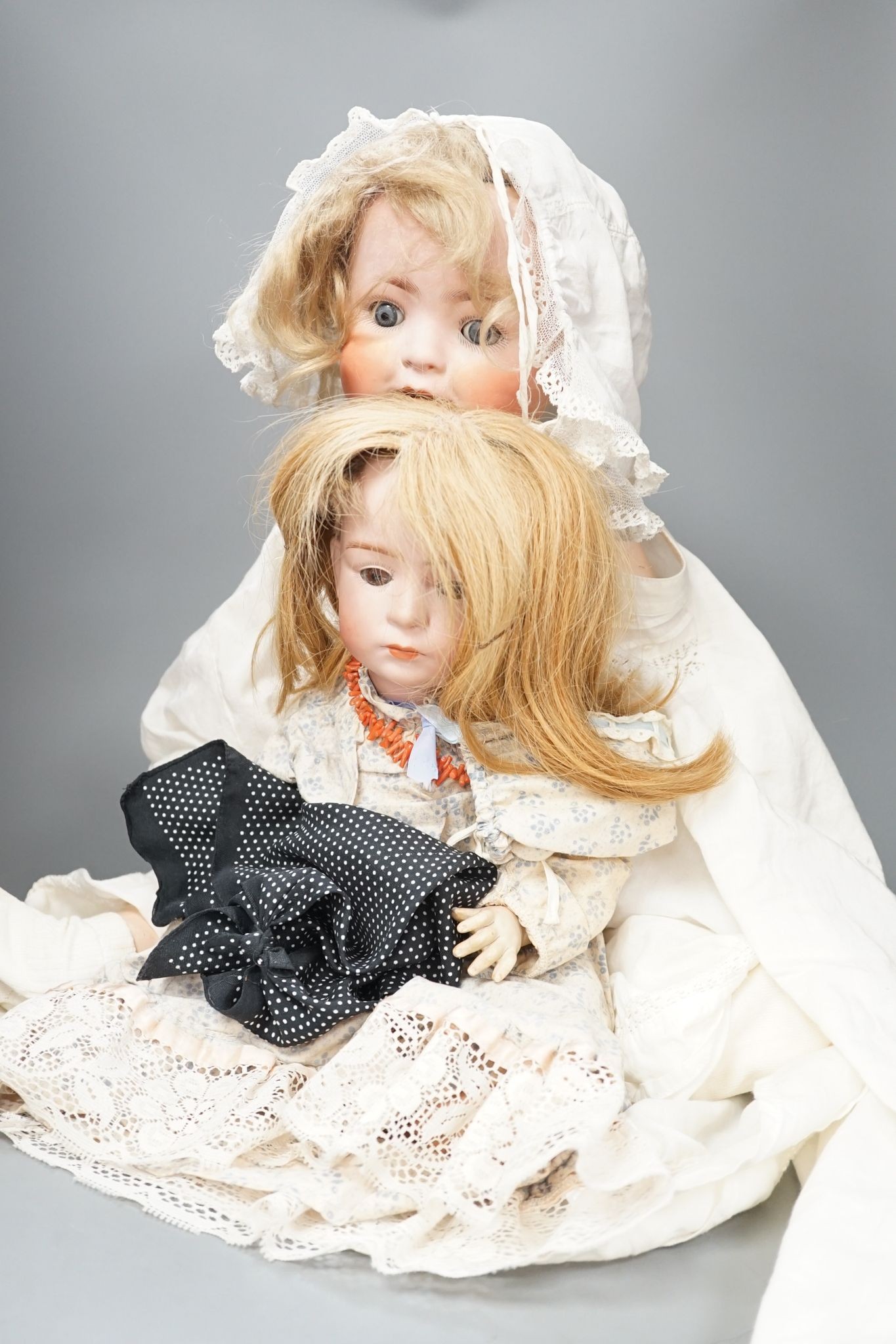 A German Porzellanfabrik Burggrab bisque headed doll, one other bisque headed doll